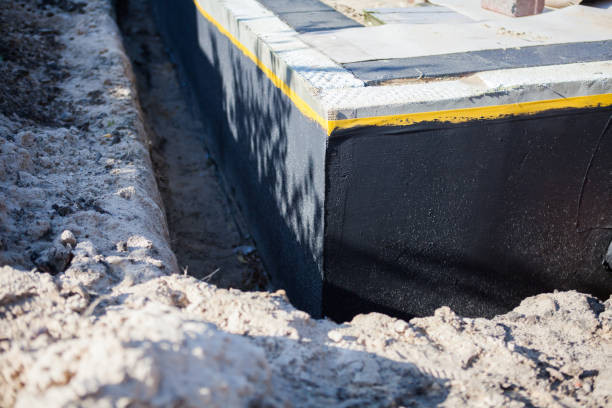 Professional Basement Waterproofing technician working in Piqua, OH
